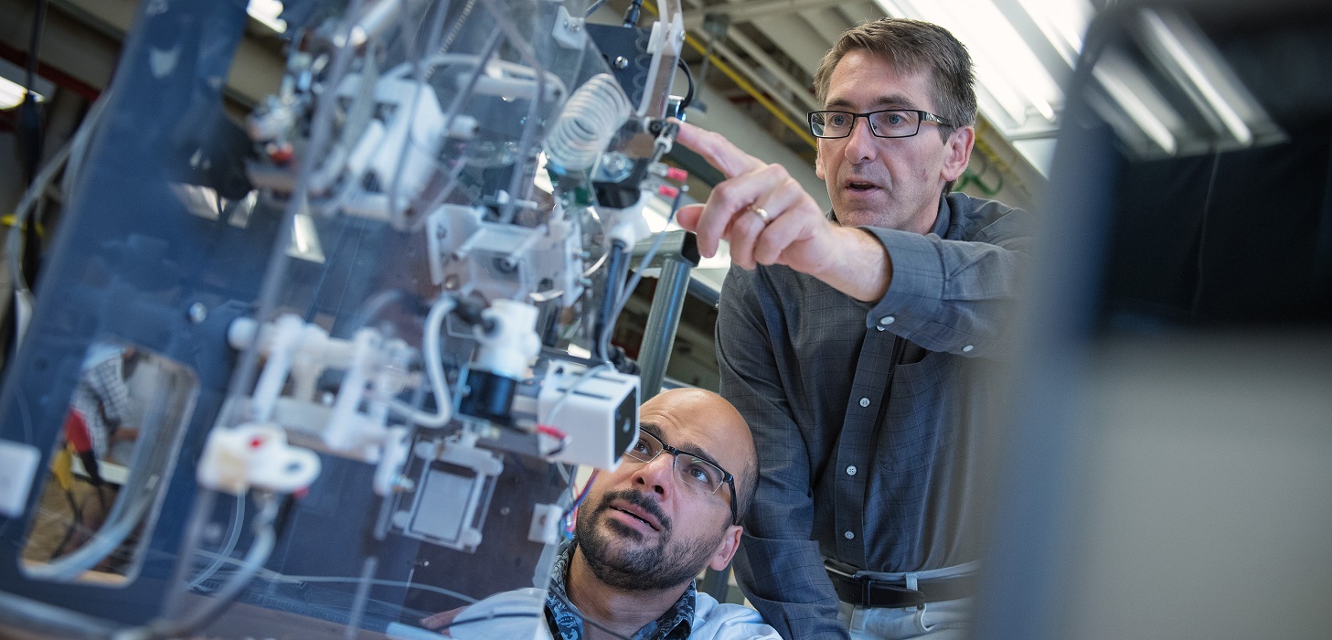 Professor James Olson with post-doctoral research fellow Hayder Salem in the Pulp and Paper Centre lab.